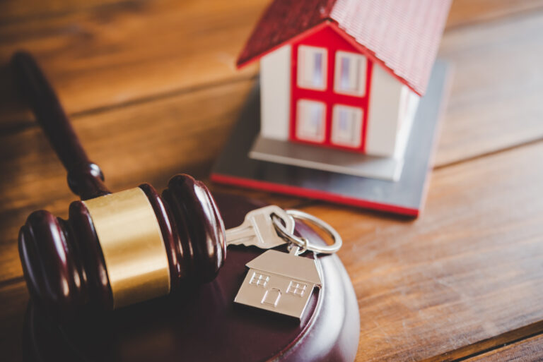 Model of house and gavel.House auction real estate law concept